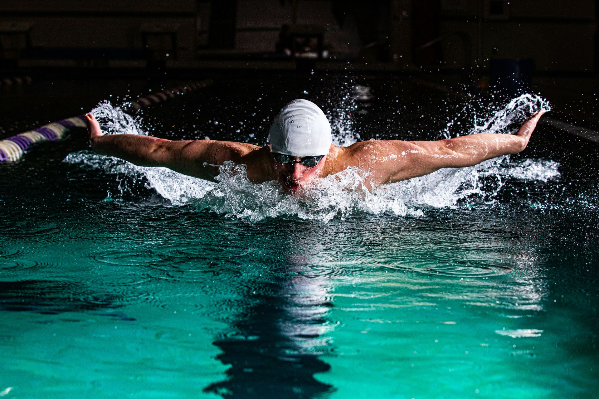 A picture of a swimmer preparing for the Olympics.
